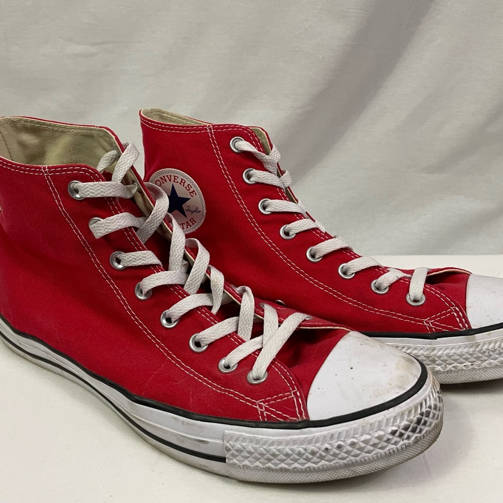 Converse Chuck Taylors. Red hi tops.
